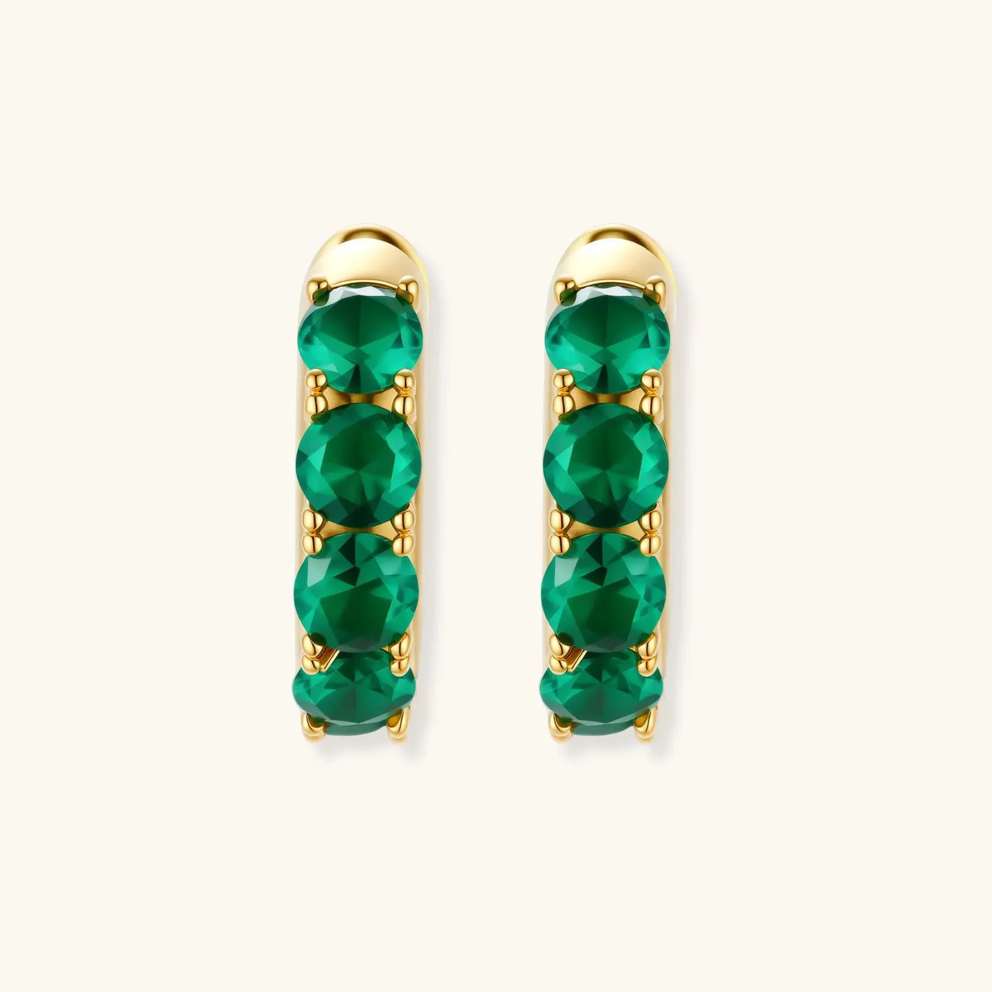 Emerald Huggie Hoops by Equanimity Essence.
