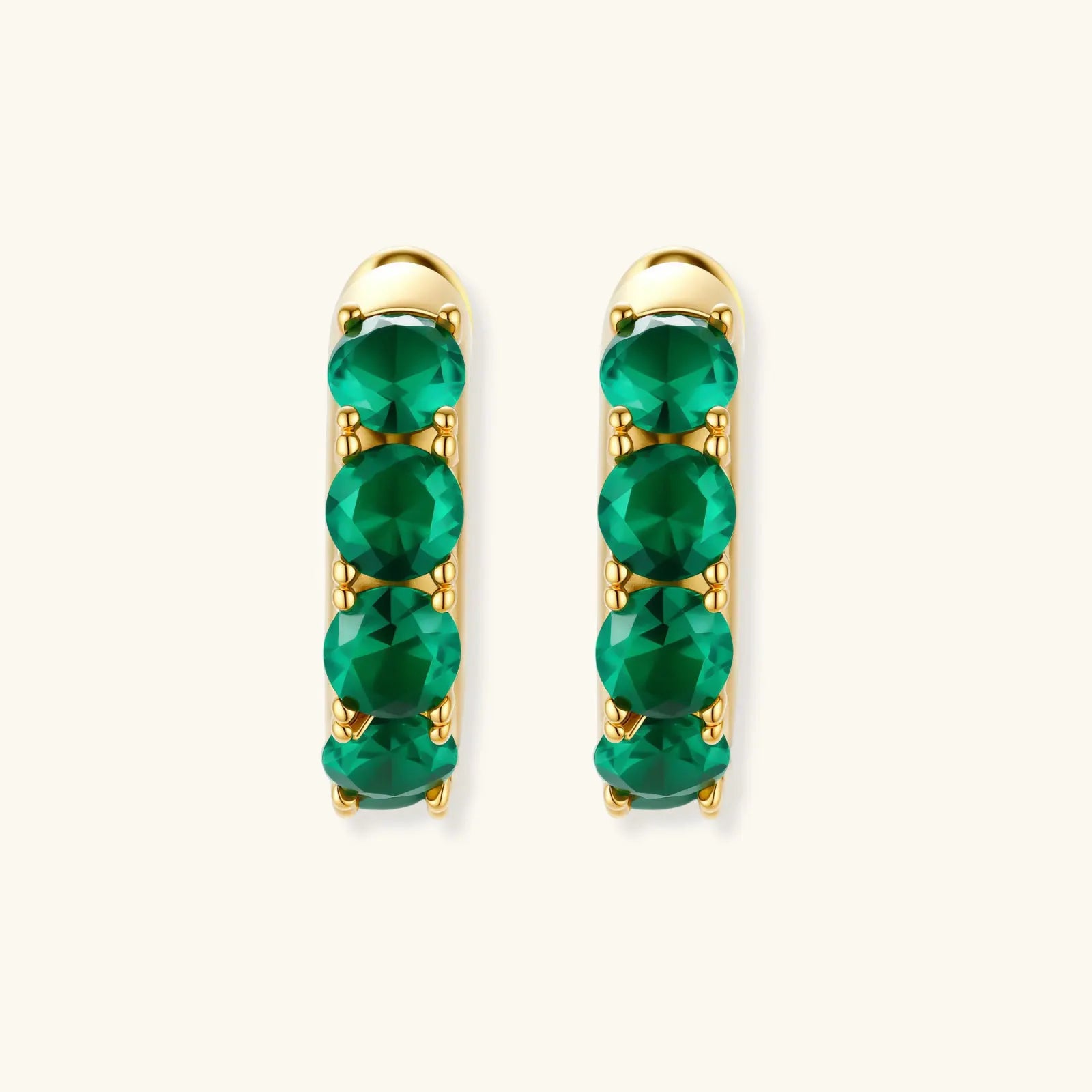 Emerald Huggie Hoops by Equanimity Essence.