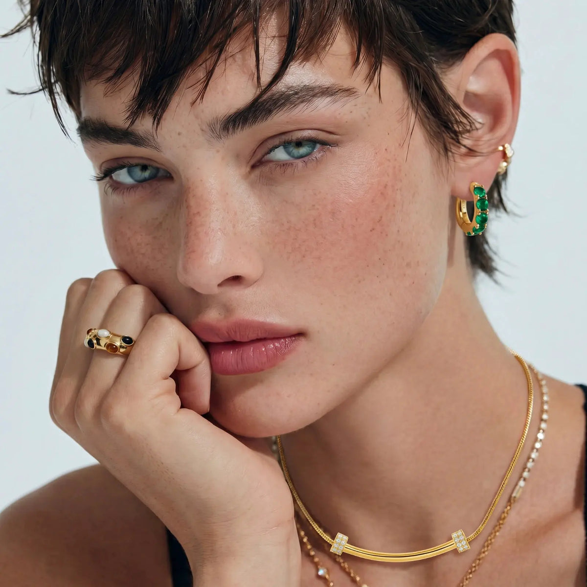 Emerald Huggie Hoops by Equanimity Essence.