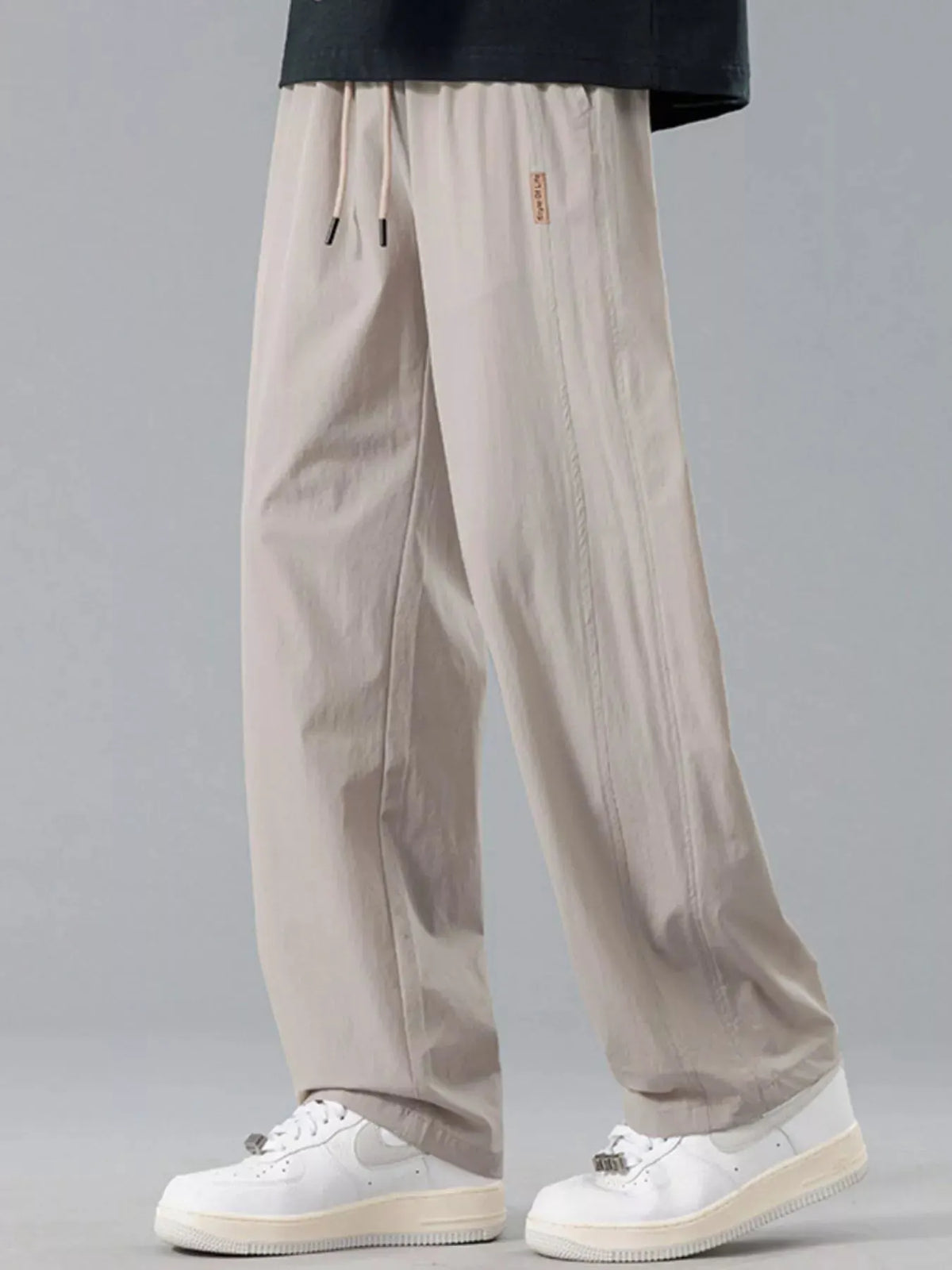 Men's Plus Size Loose Fit Drawstring Casual Pants by Trendsi