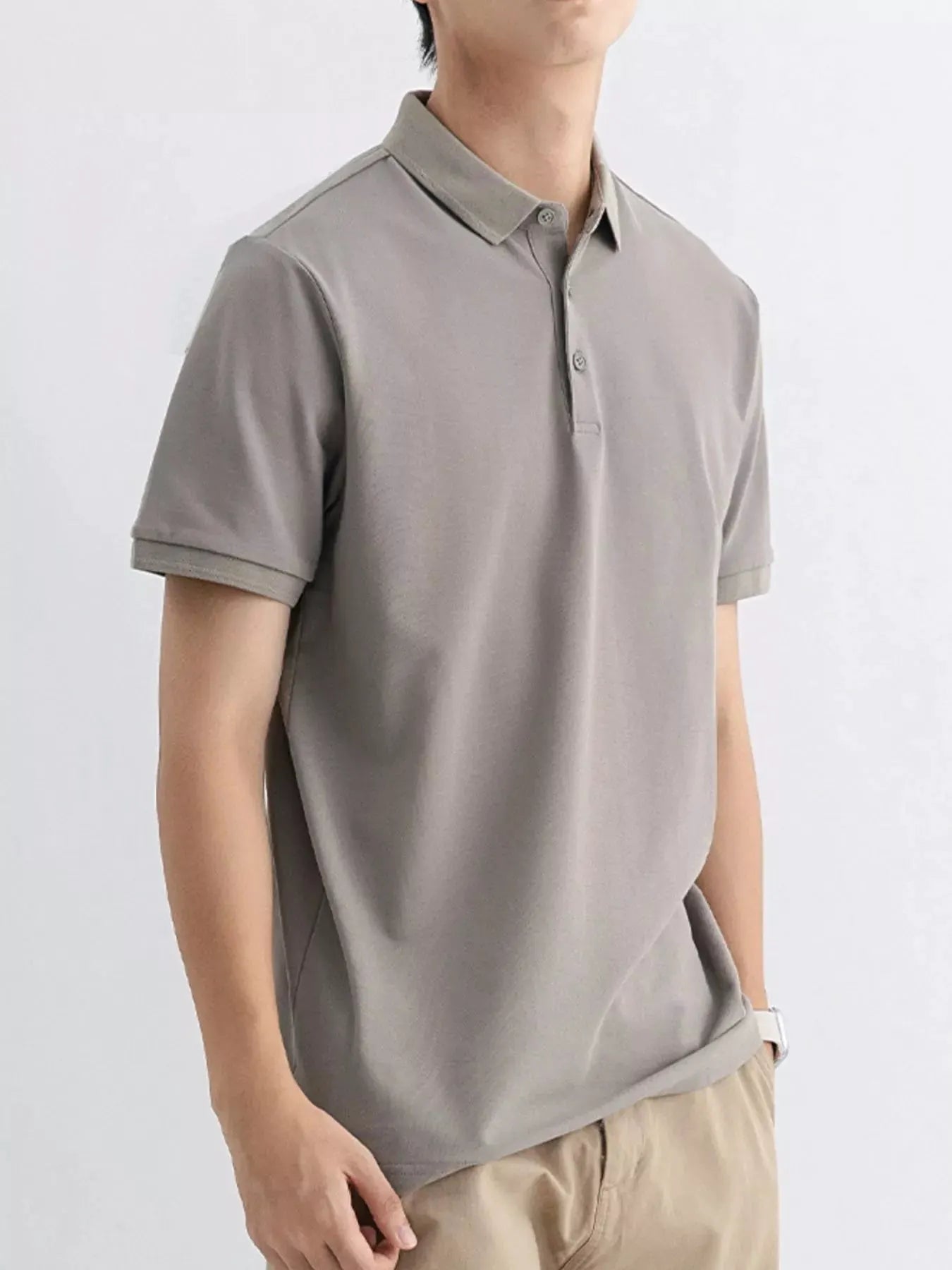 Men's Plus Size Solid Color Short Sleeve Polo by Trendsi