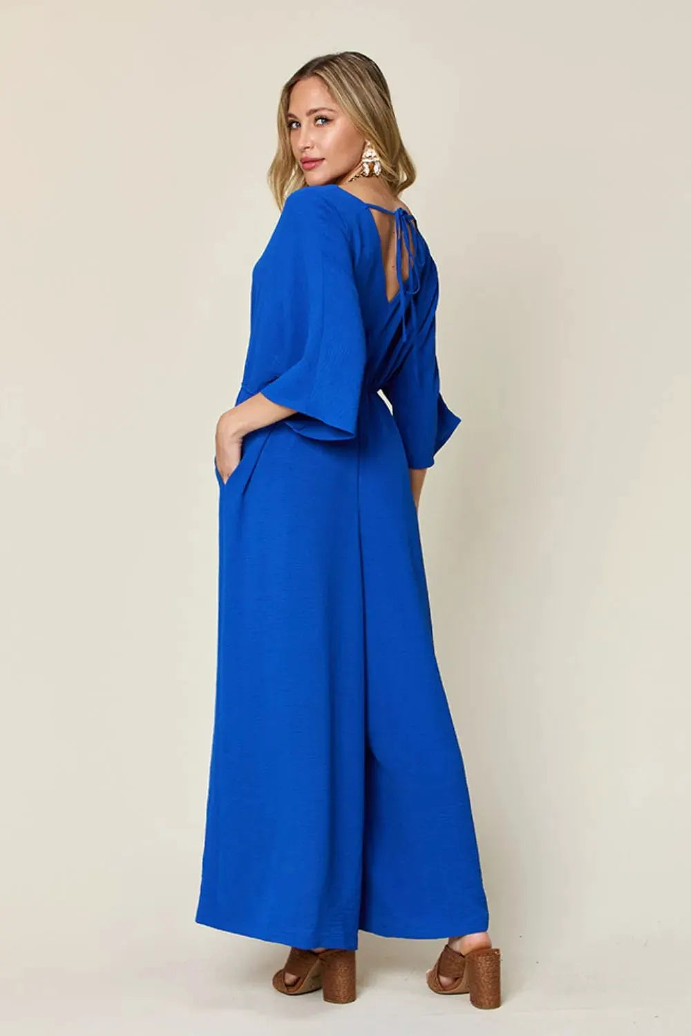 Double Take Full Size Surplice Wide Leg Jumpsuit with Pockets by Double Take