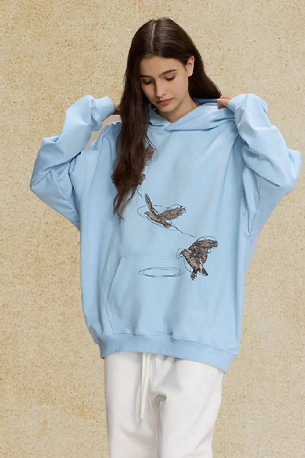 Men's Graphic Long Sleeve Hoodie with Kangaroo Pocket by Trendsi